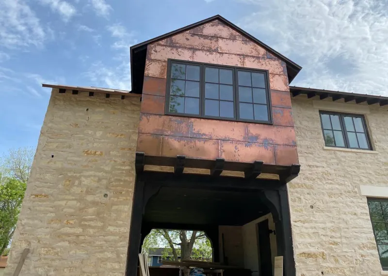 Copper metal panel facade on a stone building for Metal Roof Coating in Overlea